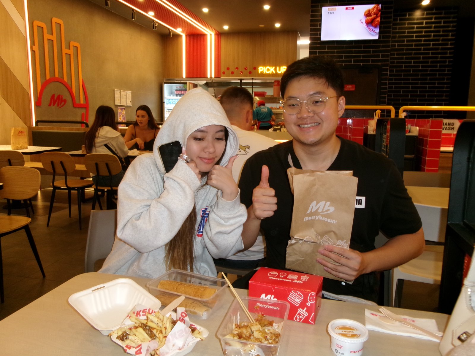 Friends sharing hotpot around a steaming table